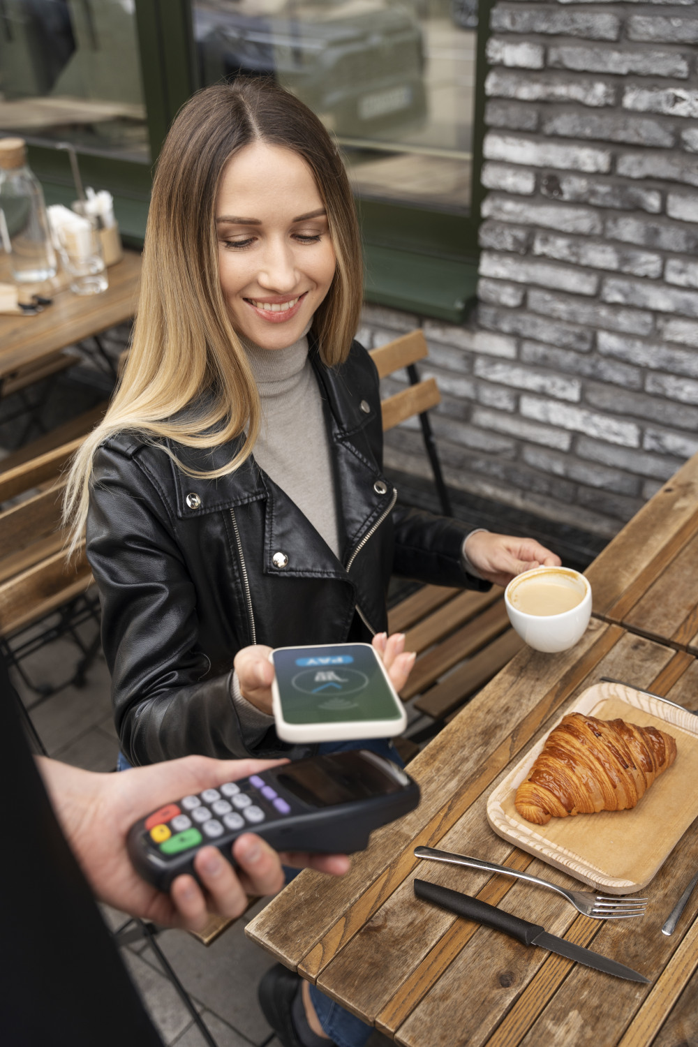 woman making a cashless payment